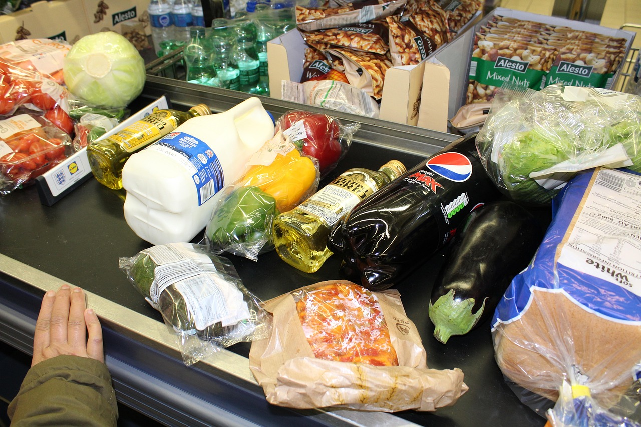 Shoppers moving through a supermarket - surveillance pricing aims to turn the data trail left by everyday shopping into a price tailored to each person.