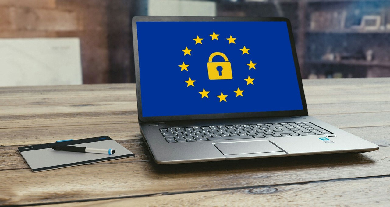 A laptop screen showing the European Union's circle of stars around a padlock, symbolising EU data-protection rules.